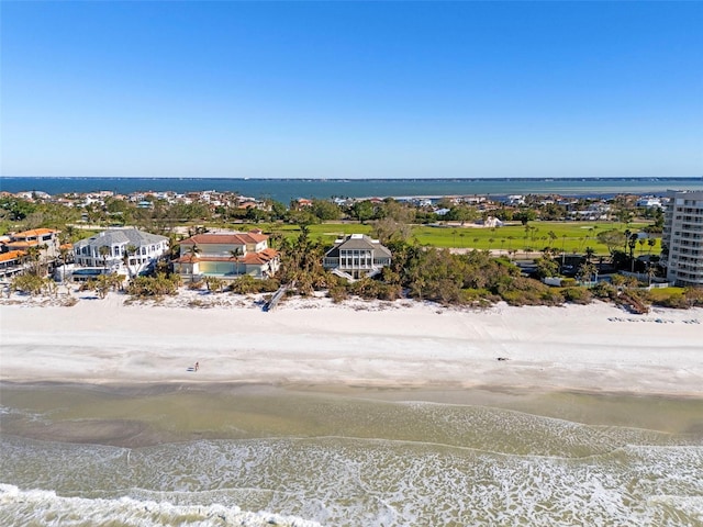 bird's eye view with a water view and a view of the beach