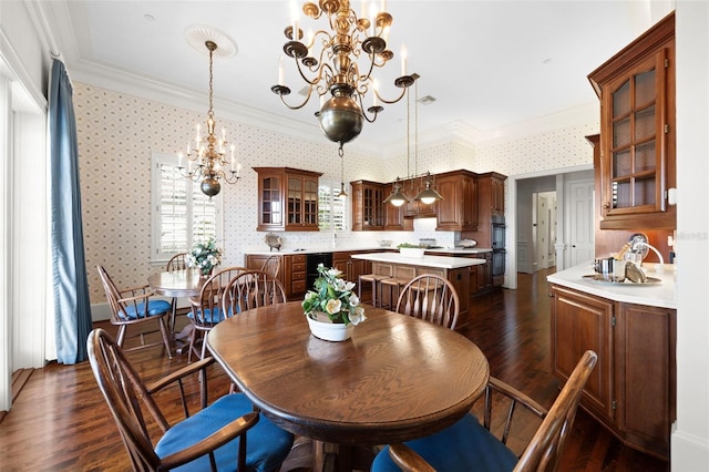 dining space with dark hardwood / wood-style flooring, an inviting chandelier, and crown molding