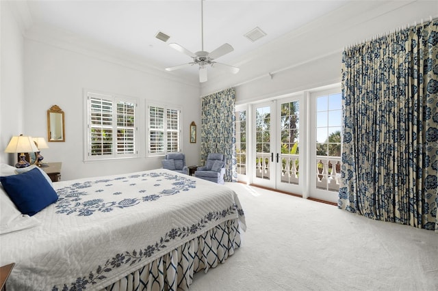 carpeted bedroom with access to exterior, ceiling fan, crown molding, and french doors