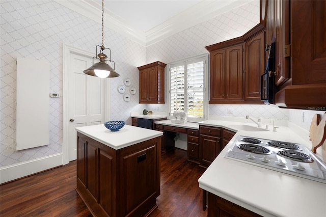 kitchen with pendant lighting, a center island, sink, dark hardwood / wood-style floors, and ornamental molding