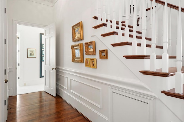 corridor featuring dark hardwood / wood-style floors