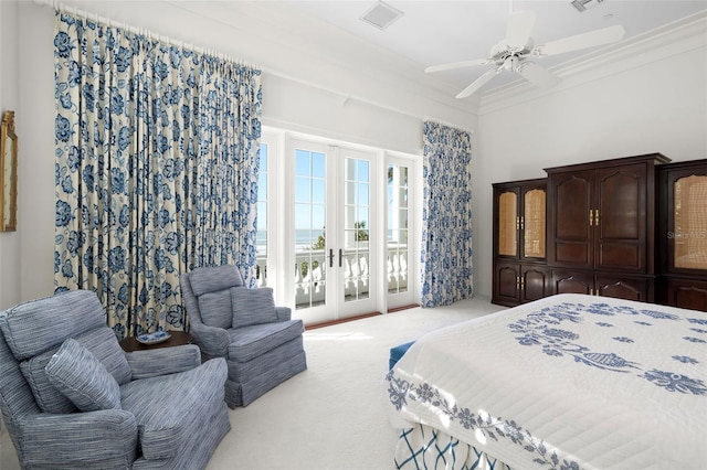 carpeted bedroom featuring access to exterior, ceiling fan, french doors, and ornamental molding