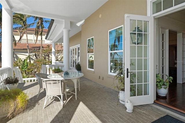 sunroom / solarium with french doors and ornate columns