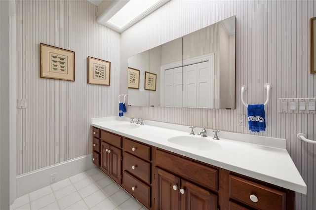 bathroom with tile patterned flooring and vanity