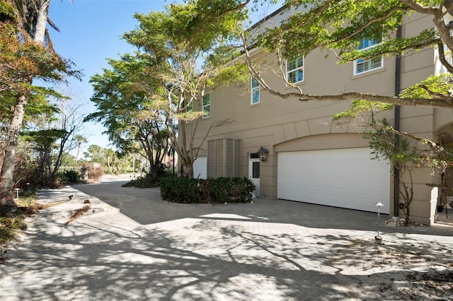 view of front of property with a garage