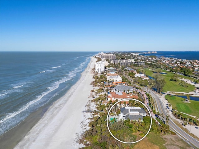 aerial view with a view of the beach and a water view