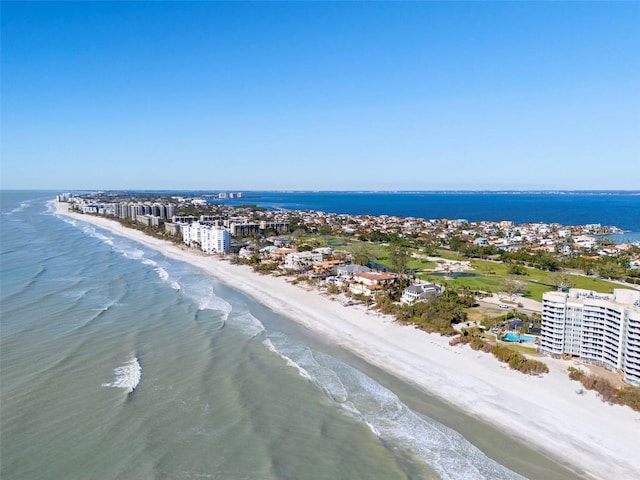 bird's eye view featuring a view of the beach and a water view