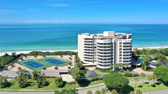 aerial view featuring a water view and a beach view