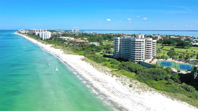 bird's eye view with a water view and a view of the beach