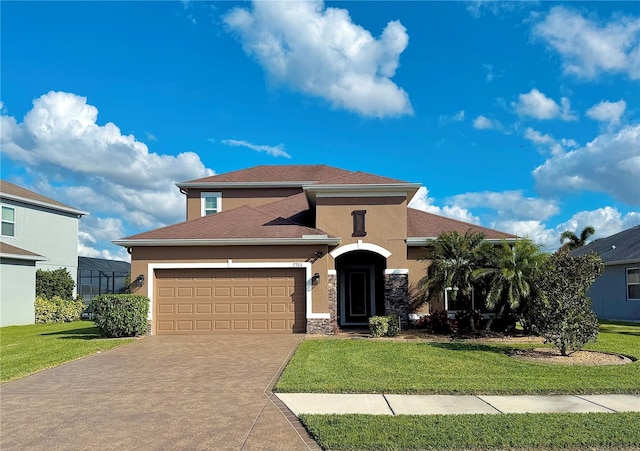 view of front of property featuring a front yard and a garage