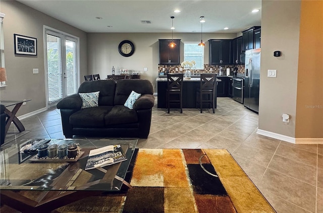 living room with light tile patterned floors