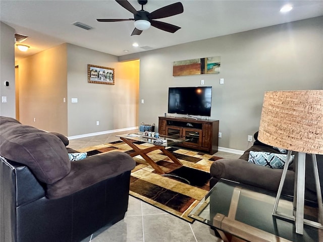 tiled living room with ceiling fan