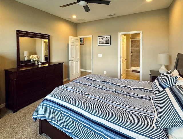 carpeted bedroom featuring connected bathroom and ceiling fan