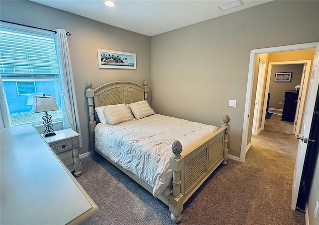 bedroom featuring dark colored carpet