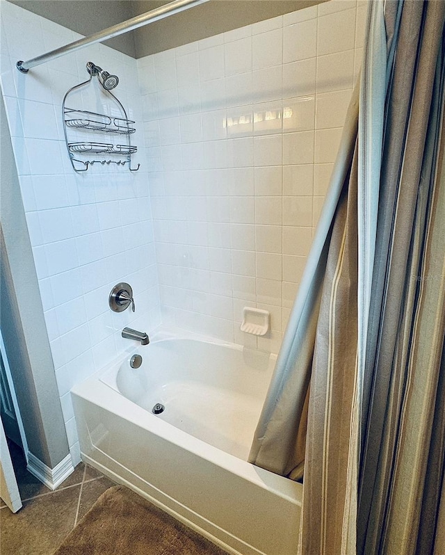 bathroom featuring tile patterned floors and shower / bathtub combination with curtain