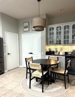 dining area featuring light tile patterned floors