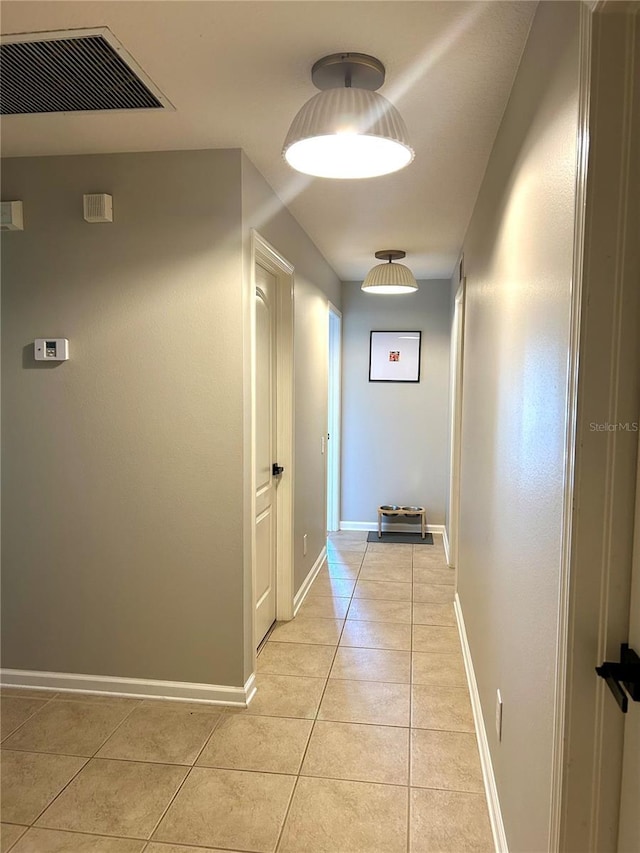 hallway with light tile patterned floors