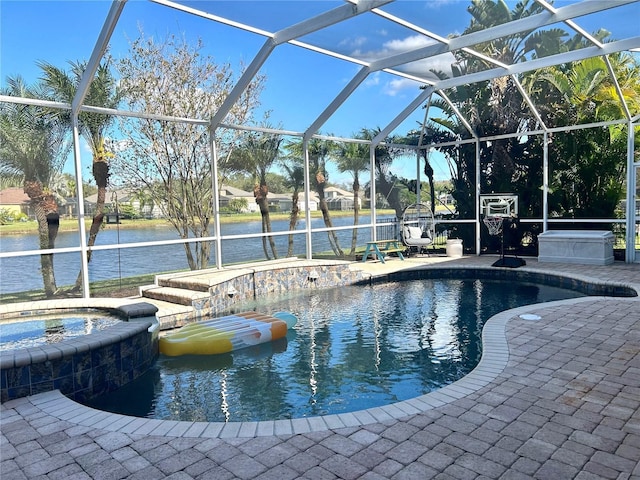 view of swimming pool with a patio, an in ground hot tub, glass enclosure, and a water view