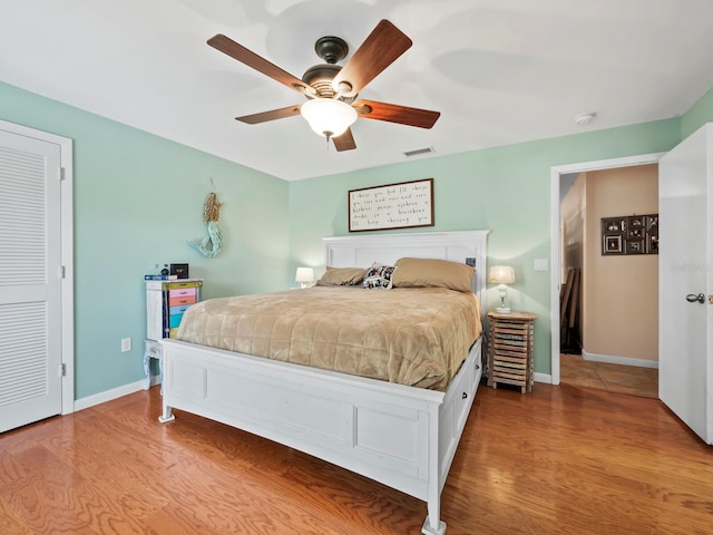 bedroom featuring hardwood / wood-style flooring and ceiling fan