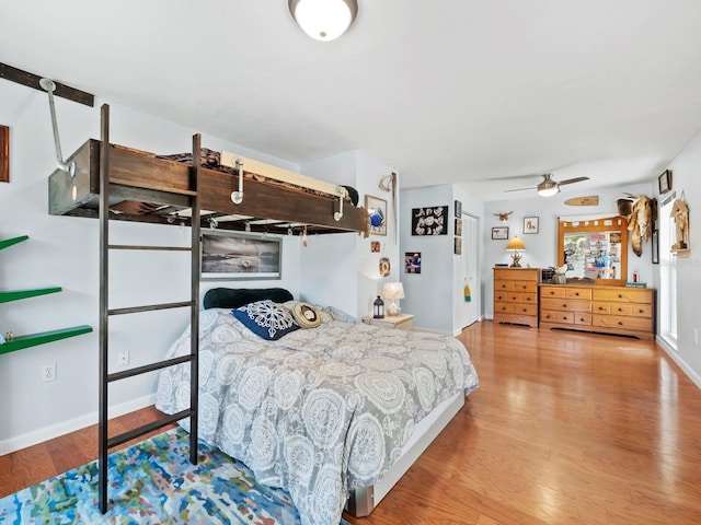 bedroom featuring ceiling fan and wood-type flooring