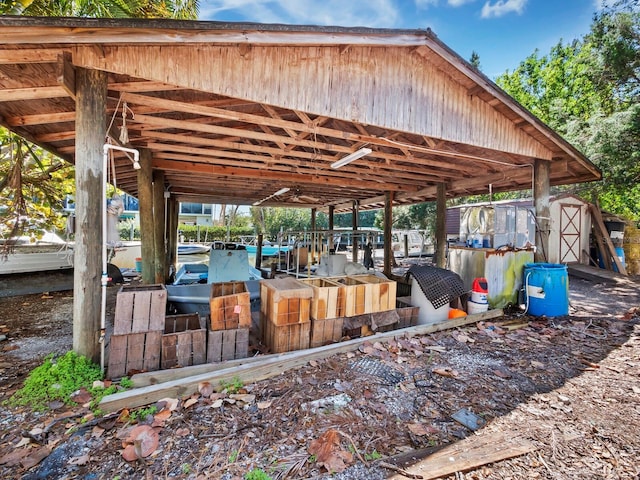 view of patio with a storage shed