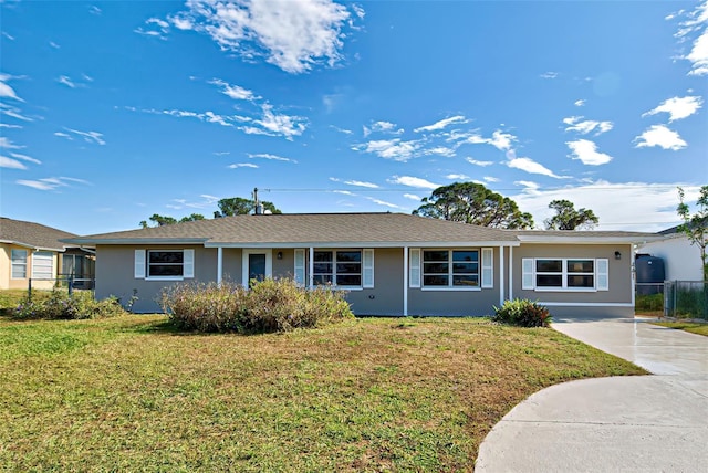 ranch-style house with a front lawn