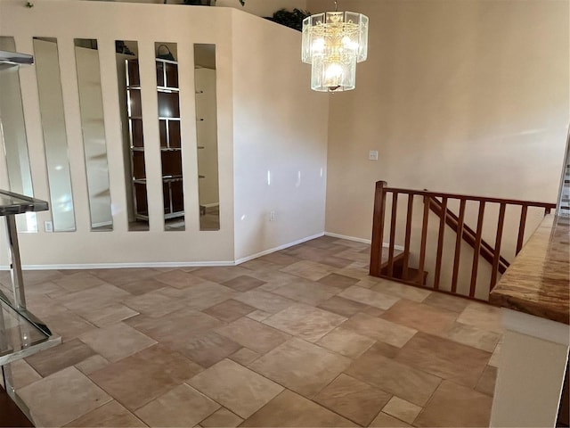 unfurnished dining area featuring a chandelier