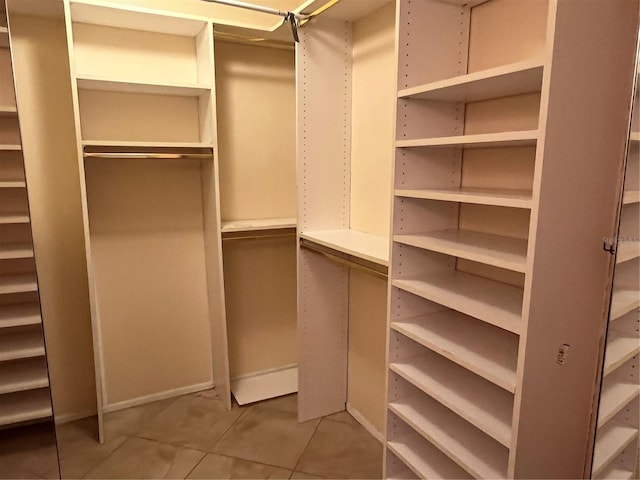 spacious closet with tile patterned flooring