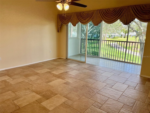 unfurnished room with ceiling fan