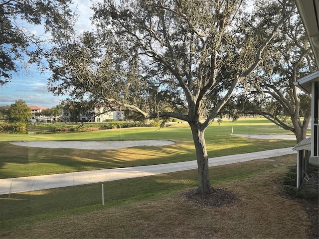 surrounding community featuring a lawn