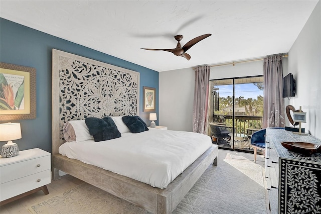 bedroom featuring access to exterior, ceiling fan, and light hardwood / wood-style flooring