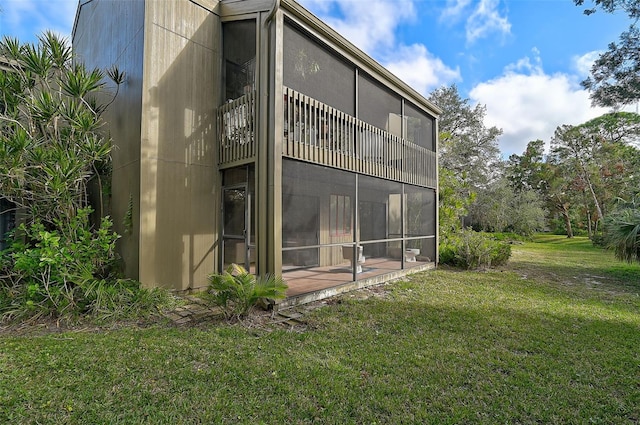 rear view of property with a yard