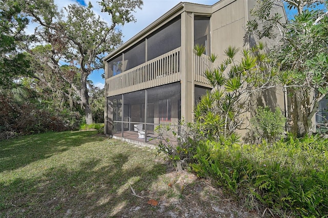 rear view of house with a yard and a patio