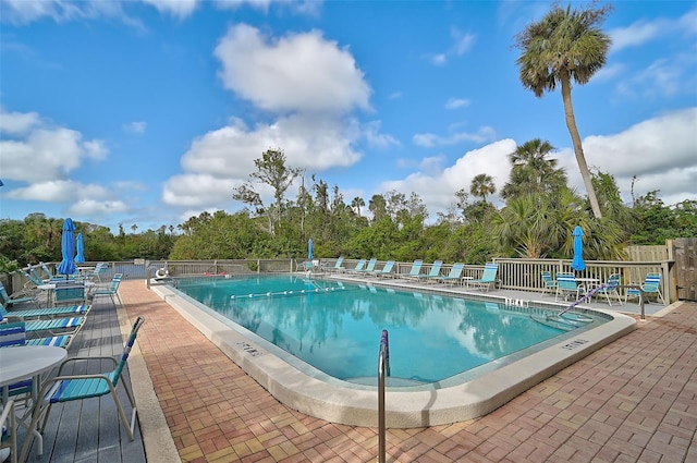 view of swimming pool with a patio area