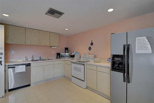 kitchen with sink and appliances with stainless steel finishes