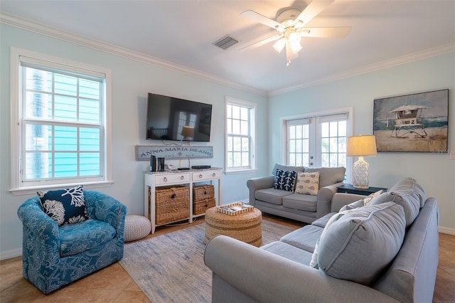 living room featuring ceiling fan, light tile patterned floors, crown molding, and french doors