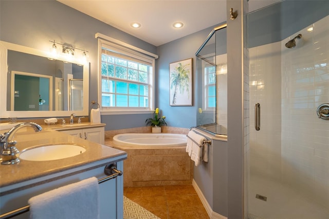 bathroom featuring tile patterned floors, vanity, and separate shower and tub