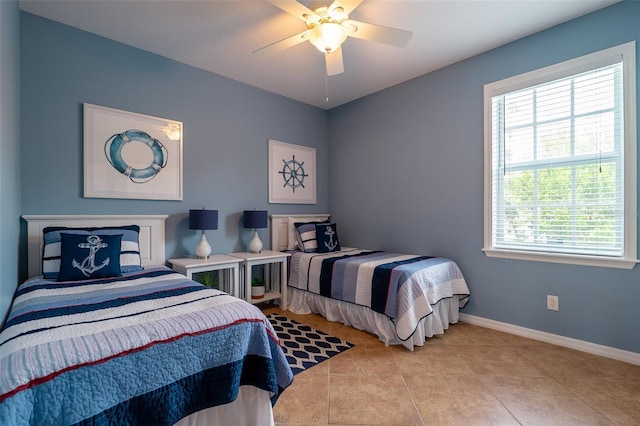 tiled bedroom with ceiling fan