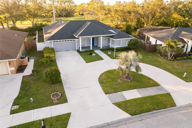 view of front of home featuring a garage and a front lawn