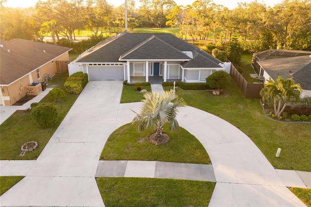 view of front of home featuring a garage and a front lawn