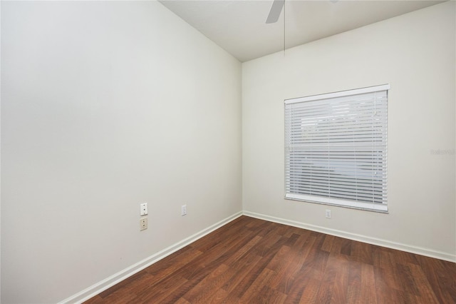 empty room with ceiling fan and dark wood-type flooring