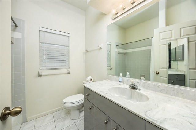 bathroom featuring tile patterned floors, vanity, toilet, and walk in shower