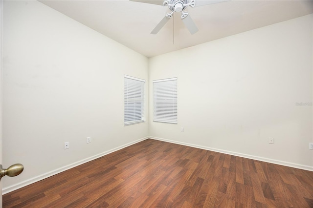 spare room featuring ceiling fan and dark hardwood / wood-style flooring