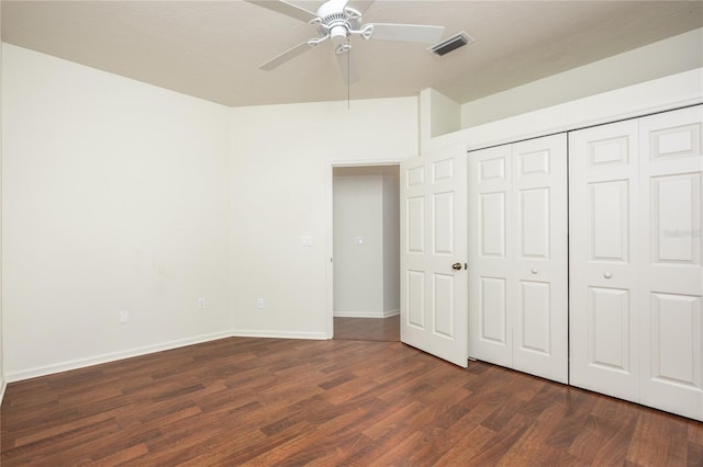 unfurnished bedroom featuring a closet, ceiling fan, and dark hardwood / wood-style flooring