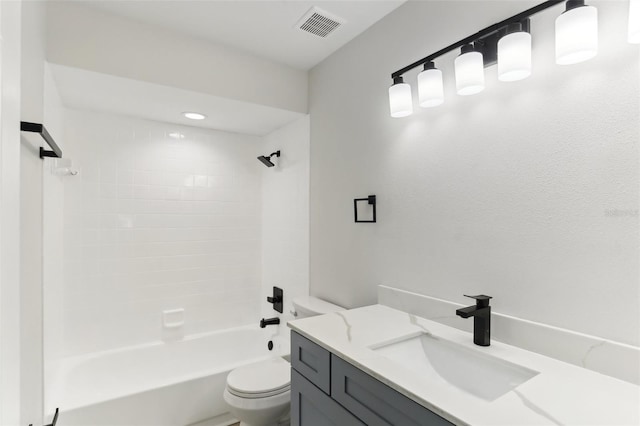 full bathroom featuring vanity, toilet, and tiled shower / bath combo