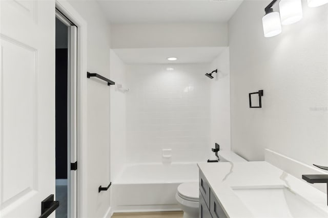 full bathroom featuring vanity, toilet, and tiled shower / bath combo