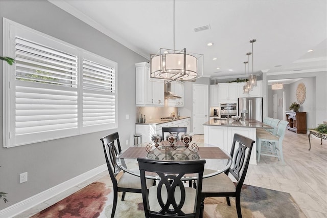 tiled dining space featuring crown molding and a chandelier