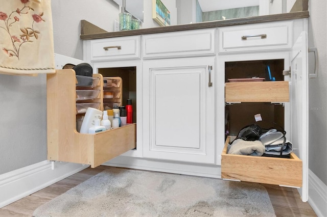 bathroom with hardwood / wood-style flooring