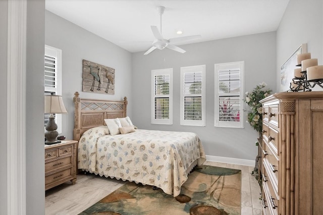 tiled bedroom with ceiling fan