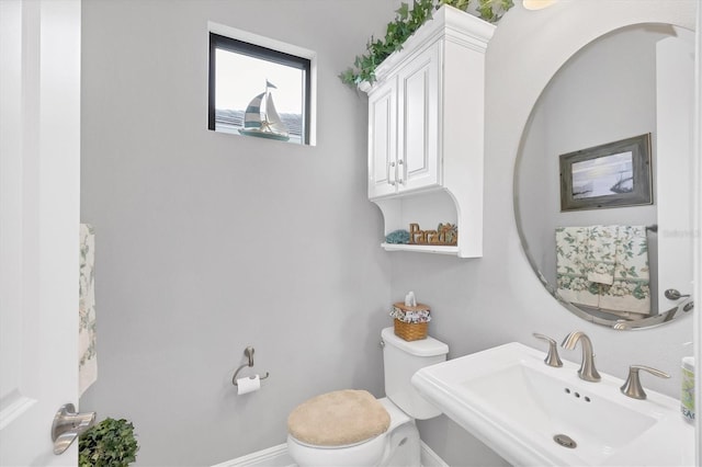 bathroom with sink and toilet